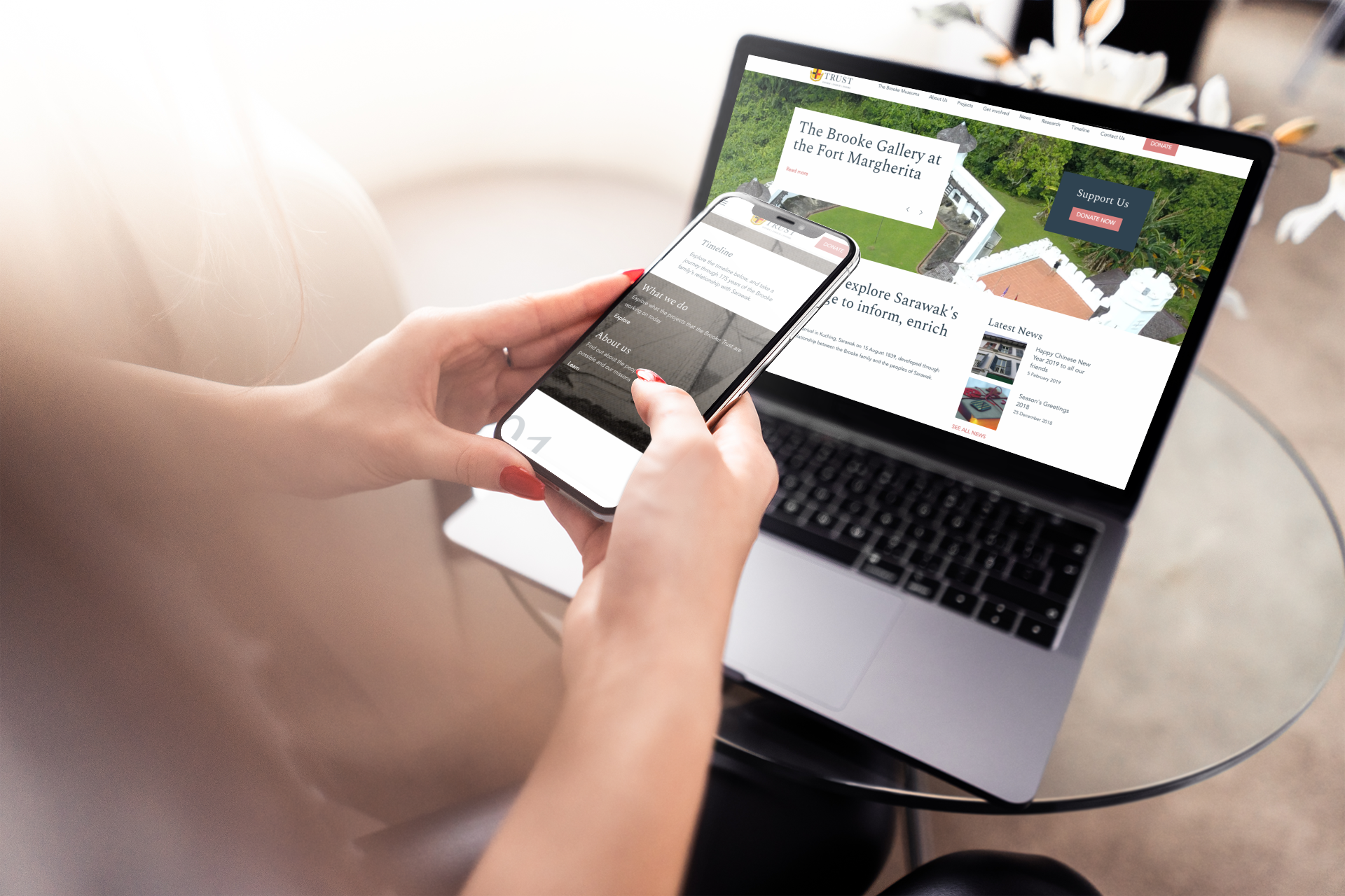 Mock of woman on phone and laptop looking at the Brooke trust website